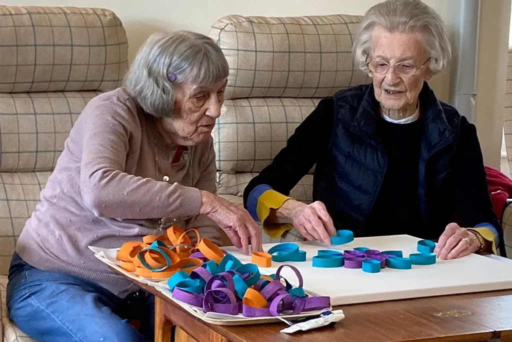 Residents of Swarthmore Residential Care Home taking part in arts and crafts.