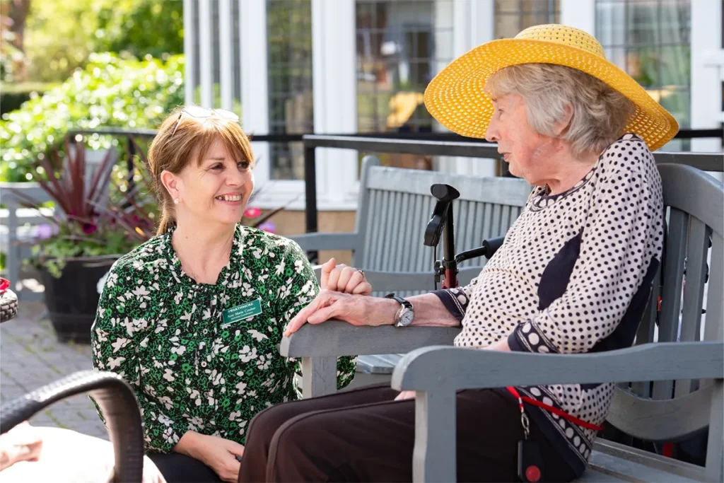 Image of a resident and a carer at Swarthmore Residential Care Home.