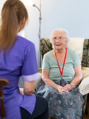 Photo of a resident and staff at Swarthmore Care Home.