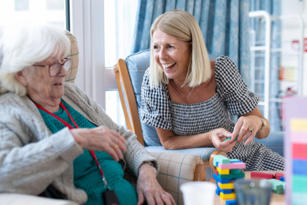 Photo of a resident and Sally Warminger, Success Manager at Swarthmore Care Home.